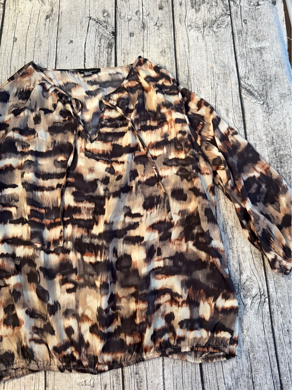 Like new. Silky blouse, front tie, elastic cuffs, elastic waist. Size XL